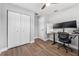 Bedroom features wood-look floors, closet, and a dedicated workstation area at 7210 14Th N St, St Petersburg, FL 33702