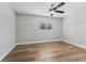 Bright and airy bedroom with wood-look floors and ceiling fan at 7210 14Th N St, St Petersburg, FL 33702
