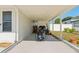 Covered carport area, can park a motorcycle, with adjacent yard space at 7210 14Th N St, St Petersburg, FL 33702