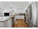 Stylish kitchen features white cabinetry, stainless steel appliances, and granite countertops at 7210 14Th N St, St Petersburg, FL 33702