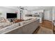 Bright open-concept living area connected to a modern kitchen with an eat-in countertop at 7210 14Th N St, St Petersburg, FL 33702
