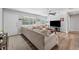 Comfortable living room area with neutral color palette, wood-look floors, and plenty of natural light at 7210 14Th N St, St Petersburg, FL 33702
