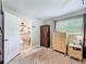 Main bedroom featuring an ensuite bathroom with toilet, sink and wooden storage at 7211 Red Oak Loop, New Port Richey, FL 34654