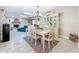 Inviting dining room with elegant chandelier, lovely decor, and easy access to the living room, creating an open feel at 7211 Red Oak Loop, New Port Richey, FL 34654