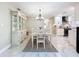 Dining room with stylish decor flowing into kitchen and front door at 7211 Red Oak Loop, New Port Richey, FL 34654