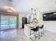 Bright kitchen island with barstool seating and pool views at 7211 Red Oak Loop, New Port Richey, FL 34654