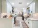 Bright kitchen with stainless steel appliances and white cabinets at 7211 Red Oak Loop, New Port Richey, FL 34654