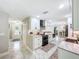 Open concept kitchen with stainless appliances and lots of cabinet space at 7211 Red Oak Loop, New Port Richey, FL 34654