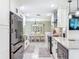 Bright, open kitchen with stainless steel appliances and white cabinets at 7211 Red Oak Loop, New Port Richey, FL 34654