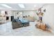 Open living room with natural light and comfortable seating at 7211 Red Oak Loop, New Port Richey, FL 34654