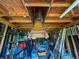 Shed's wooden interior showcasing ample storage space, shelving, and ladder at 7211 Red Oak Loop, New Port Richey, FL 34654