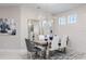 Stylish dining room features modern chandelier, shiplap accent wall, and elegant decor for sophisticated meals at 7621 Highgrove Ave, Bradenton, FL 34210