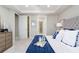 Comfortable main bedroom showcasing a tray ceiling, plush carpet, and doors to the bathroom and closet at 7621 Highgrove Ave, Bradenton, FL 34210