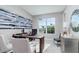 Home office displaying abundant natural light, a stylish desk setup, and elegant decor for productive work at 7621 Highgrove Ave, Bradenton, FL 34210