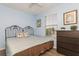 Inviting bedroom with a large window, ceiling fan, and neutral decor at 9107 Brunswick Ln, Tampa, FL 33615
