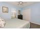 Comfortable bedroom features a large window and a closet at 9107 Brunswick Ln, Tampa, FL 33615