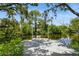 Private dock on the canal, surrounded by lush greenery, offering a serene waterfront experience at 9107 Brunswick Ln, Tampa, FL 33615