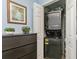 Closet features a stackable washer and dryer, with extra storage space on the side at 9107 Brunswick Ln, Tampa, FL 33615