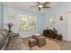 Inviting living room featuring comfortable seating, natural light, and modern decor at 9107 Brunswick Ln, Tampa, FL 33615