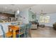 Bright, open living space with a dining area, modern furnishings, and natural light at 9107 Brunswick Ln, Tampa, FL 33615