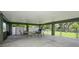 Spacious covered outdoor entertaining area with a ceiling fan and plenty of seating, perfect for gatherings at 9107 Brunswick Ln, Tampa, FL 33615