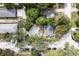 Aerial view of a home with mature trees and landscaping in a residential neighborhood at 921 Grand Central St, Clearwater, FL 33756