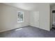 A serene bedroom with carpet and a window, offering a peaceful retreat at 921 Grand Central St, Clearwater, FL 33756