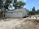 Well-maintained home with a freshly landscaped yard, featuring neutral siding and a welcoming walkway at 921 Grand Central St, Clearwater, FL 33756