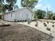 Well-maintained single-story home with fresh landscaping including stone and new plants at 921 Grand Central St, Clearwater, FL 33756