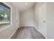 A well-lit foyer or hallway with stylish laminate flooring and a view to the outside at 921 Grand Central St, Clearwater, FL 33756