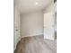 A well-lit, neutral-toned hallway with stylish laminate flooring and white paneled doors at 921 Grand Central St, Clearwater, FL 33756