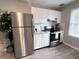 Well-lit kitchen featuring stainless steel appliances, white cabinets, and modern finishes at 921 Grand Central St, Clearwater, FL 33756