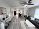 Spacious living room with modern decor, hardwood floors and a ceiling fan for comfortable living at 921 Grand Central St, Clearwater, FL 33756