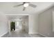 Spacious living room with hardwood floors, ceiling fan and open floor plan at 921 Grand Central St, Clearwater, FL 33756