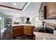 Gourmet kitchen with a large granite island, custom cabinets and stainless steel appliances at 9619 Towanda Ln, Port Richey, FL 34668