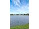 Scenic lake view with blue skies, showcasing the waterfront community and serene surroundings at 9619 Towanda Ln, Port Richey, FL 34668