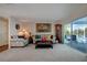 Cozy living room with comfortable seating and a view of the pool at 9619 Towanda Ln, Port Richey, FL 34668