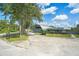 Exterior view of home featuring a unique architectural design and driveway at 9938 Alavista Dr, Gibsonton, FL 33534