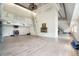 Bright living room with light wood flooring, modern fireplace and an impressive ceiling height at 9938 Alavista Dr, Gibsonton, FL 33534