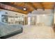 This main bedroom offers plenty of space, with wood ceilings, a large bathroom with tub, and glass enclosed shower at 9938 Alavista Dr, Gibsonton, FL 33534