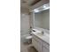 Bathroom featuring a bathtub and a vanity with ample lighting at 10024 Cedar Dune Dr, Tampa, FL 33624