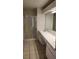 Bathroom with a double sink vanity and a walk-in shower at 10024 Cedar Dune Dr, Tampa, FL 33624