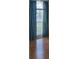 Bedroom with hardwood floors, large window, and curtains at 10024 Cedar Dune Dr, Tampa, FL 33624