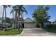 Charming single-story home featuring a well-manicured lawn and a two-car garage at 10024 Cedar Dune Dr, Tampa, FL 33624