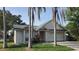 Charming single-story home with palm trees and a well-manicured lawn at 10024 Cedar Dune Dr, Tampa, FL 33624