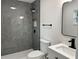 Modern bathroom featuring a sleek, tiled shower with contemporary fixtures and a stylish vanity at 1005 S Empire St, Plant City, FL 33563