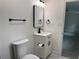 Bright bathroom with minimalist design featuring a modern vanity, black hardware, and clean lines at 1005 S Empire St, Plant City, FL 33563