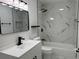 Modern bathroom featuring marble tile, updated fixtures, and a tub shower at 1005 S Empire St, Plant City, FL 33563