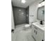 Modern bathroom featuring a glass walk-in shower and updated vanity at 1005 S Empire St, Plant City, FL 33563
