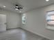 Bright, open bedroom featuring a ceiling fan, recessed lights, and wood-look flooring at 1005 S Empire St, Plant City, FL 33563